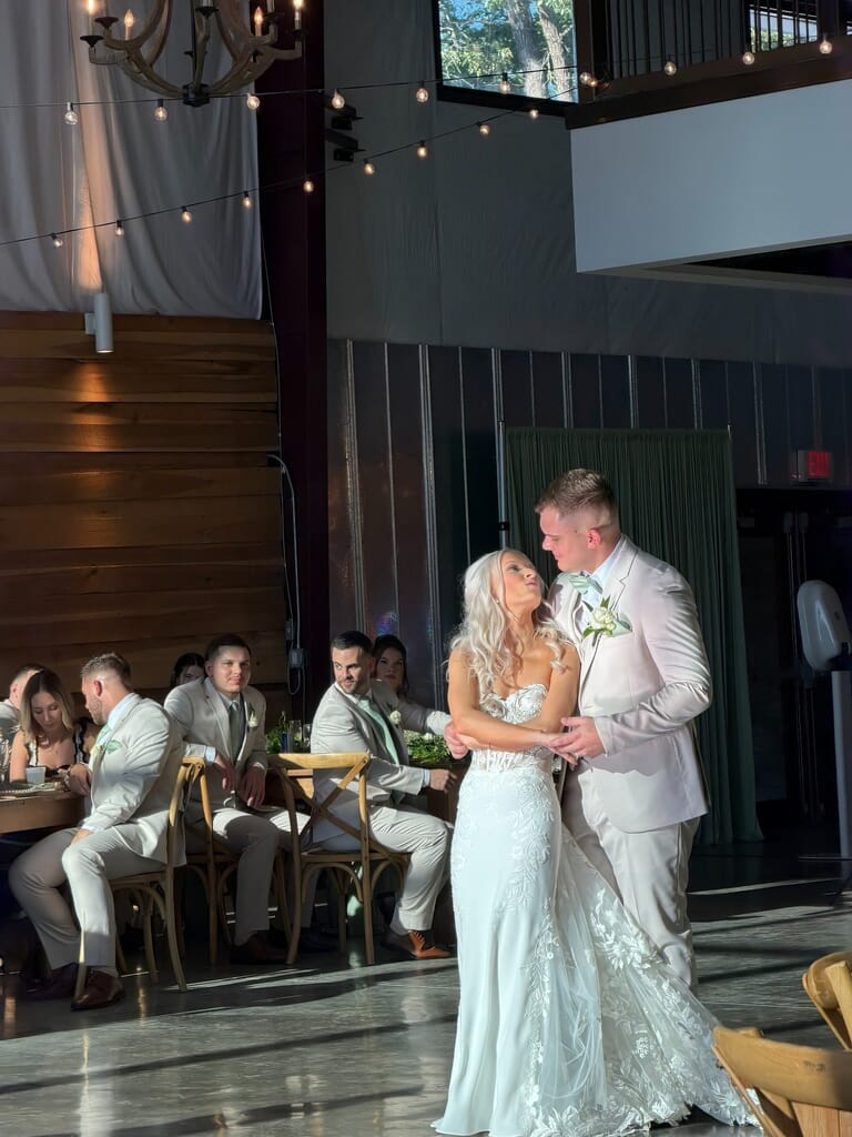 Burdoc Farms Wedding DJ | Crofton KY Wedding DJ & MC 17 Bride in a white lace dress and groom in a light suit dancing at their wedding reception