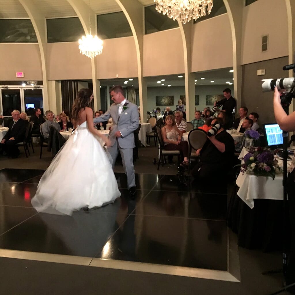 Newburgh Indiana Wedding DJ 9 Bride and groom dancing on a black dance floor at their wedding reception