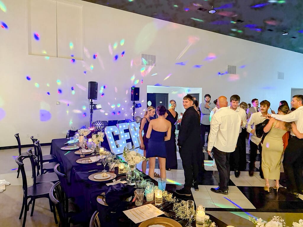 Gallery - Highbanks Wedding & Events Real Weddings 9 Guests socializing on the dance floor beside a decorated banquet table at a Highbanks reception.
